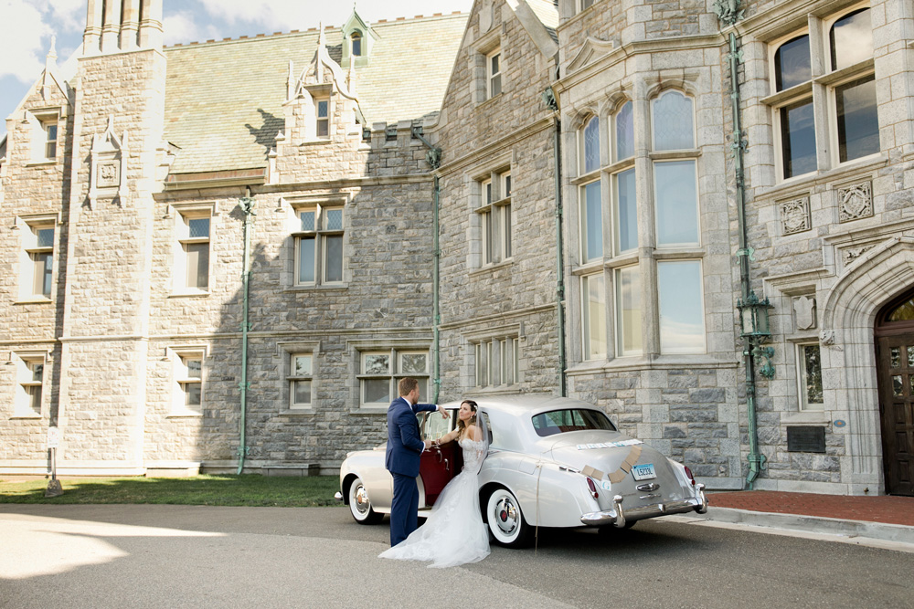 Car parked outside the Branford House with bride and groom